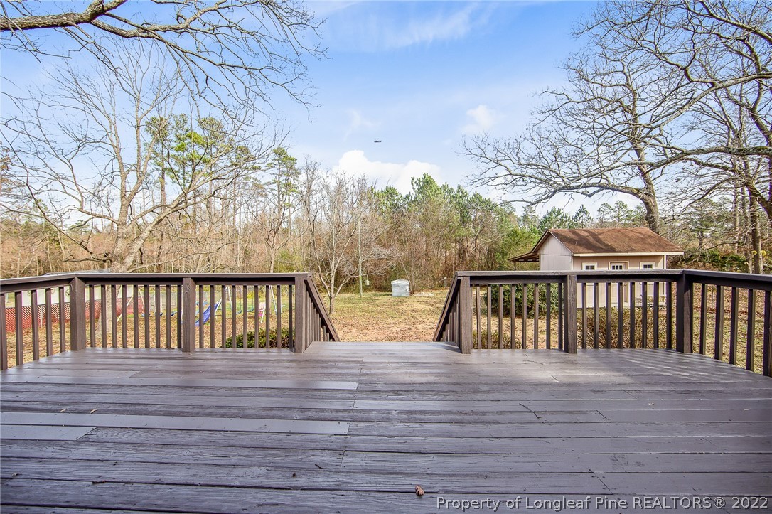 660 Pleasant Loop Fayetteville, NC 28311 - Photo 29 of 35 a view of balcony with wooden floor and fence