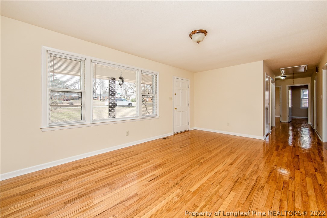 660 Pleasant Loop Fayetteville, NC 28311 - Photo 6 of 35 a view of empty room with wooden floor and fan