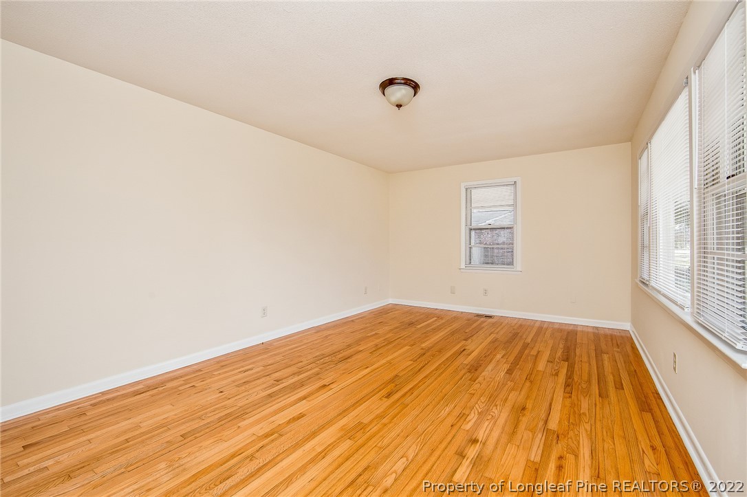 660 Pleasant Loop Fayetteville, NC 28311 - Photo 7 of 35 a view of empty room with wooden floor and fan
