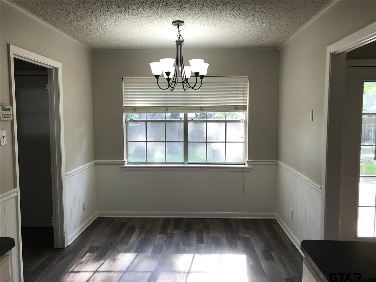 8233 Clemson Drive Tyler, TX 75703 - Photo 4 of 6 a view of an empty room with a window