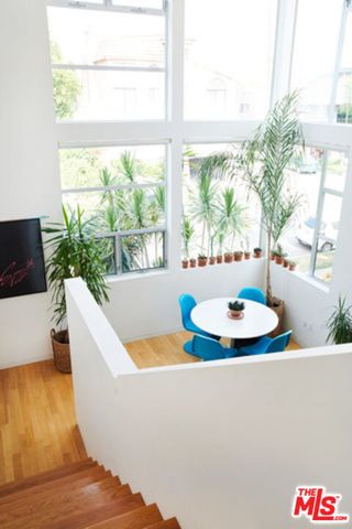 a living room with a large window and a table
