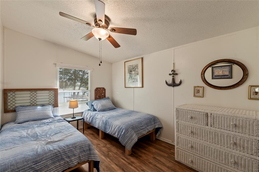 194 Indian Gap Road Mabank, TX 75156 - Photo 13 of 18 a bedroom with bed and a window