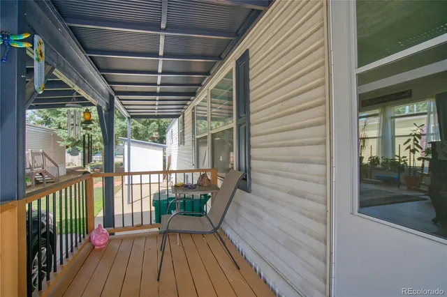 a view of a balcony with wooden floor