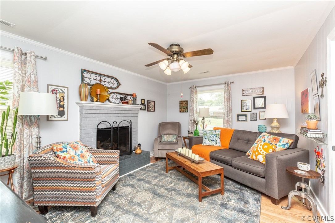 11231 Celtic Road Chesterfield, VA 23838 - Photo 14 of 26 a living room with furniture a fireplace and a window