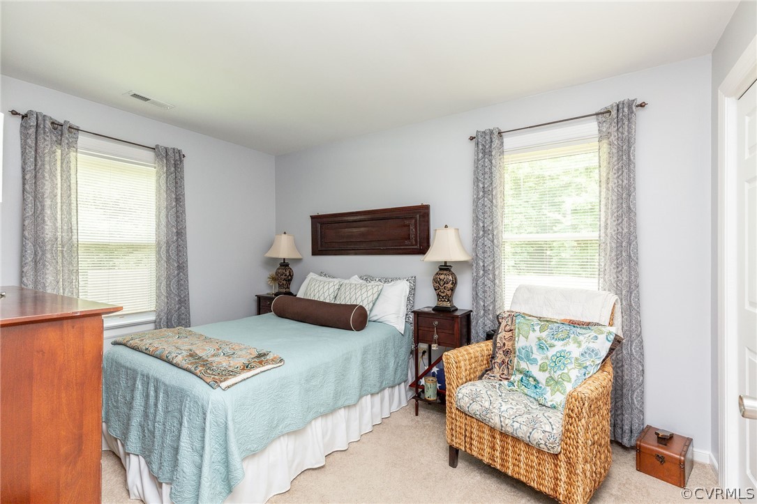 11231 Celtic Road Chesterfield, VA 23838 - Photo 17 of 26 a bedroom with a bed and a couch