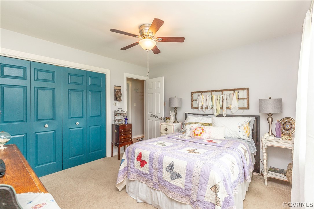 11231 Celtic Road Chesterfield, VA 23838 - Photo 18 of 26 a bedroom with a bed and a chandelier