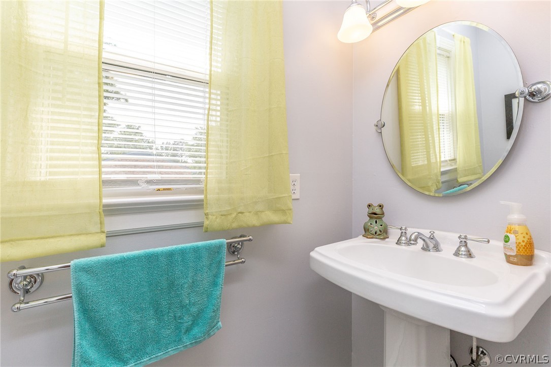 11231 Celtic Road Chesterfield, VA 23838 - Photo 20 of 26 a bathroom with a sink and a mirror