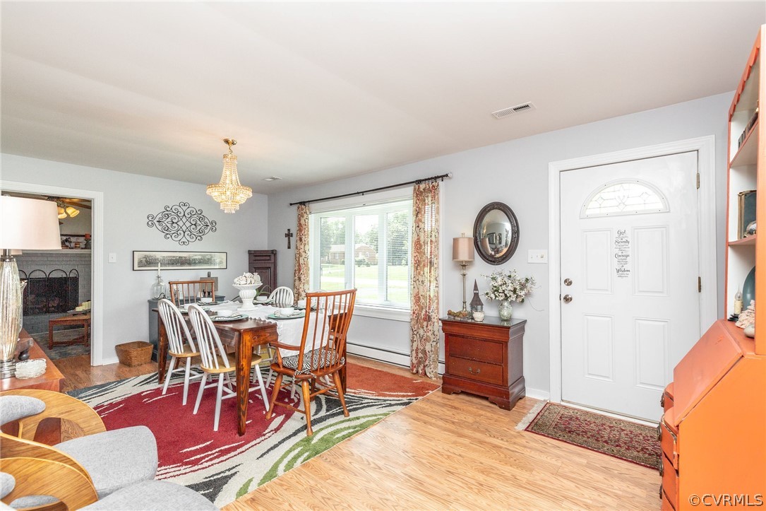 11231 Celtic Road Chesterfield, VA 23838 - Photo 6 of 26 a view of a dining room with furniture window and wooden floor