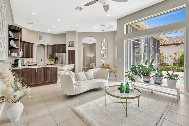 a kitchen with stainless steel appliances granite countertop a stove top oven a sink and a microwave