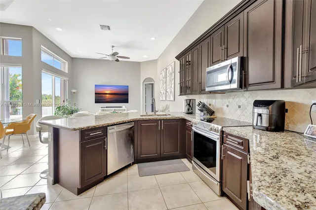 a bedroom with a large bed and a large window
