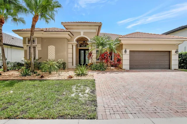 a large living room with lots of furniture and mirrors
