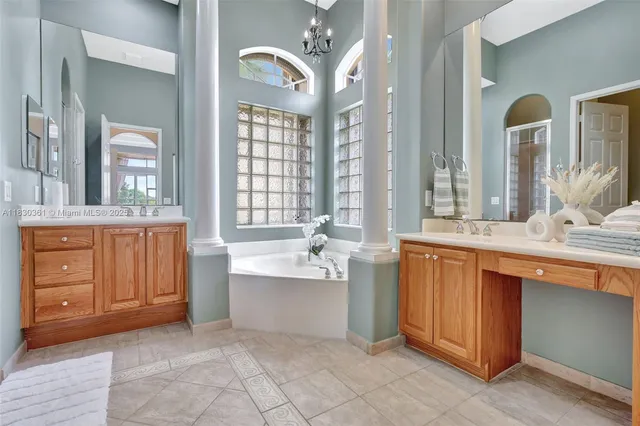 a bedroom with a large bed and a flat screen tv