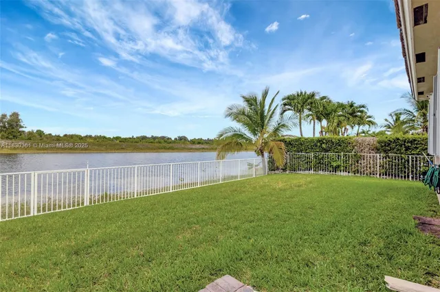 an aerial view of house with yard