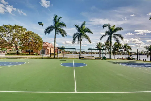 a view of swimming pool with outdoor seating and plants