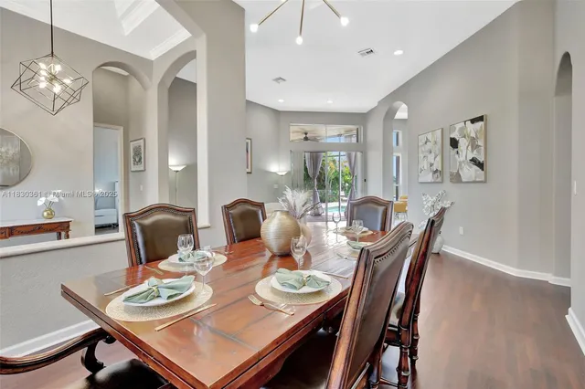a view of a dining room with furniture window and wooden floor