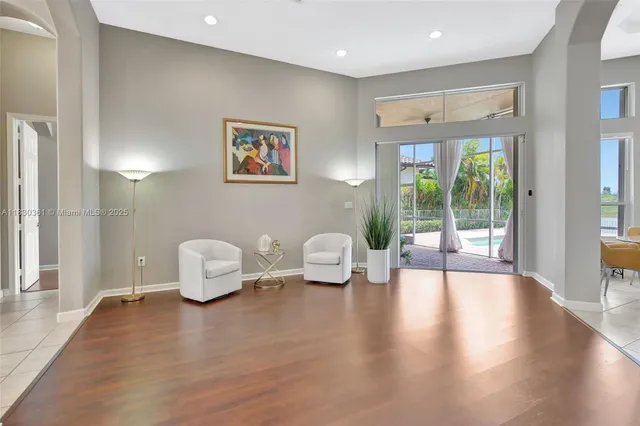 a living room with fireplace furniture and a flat screen tv