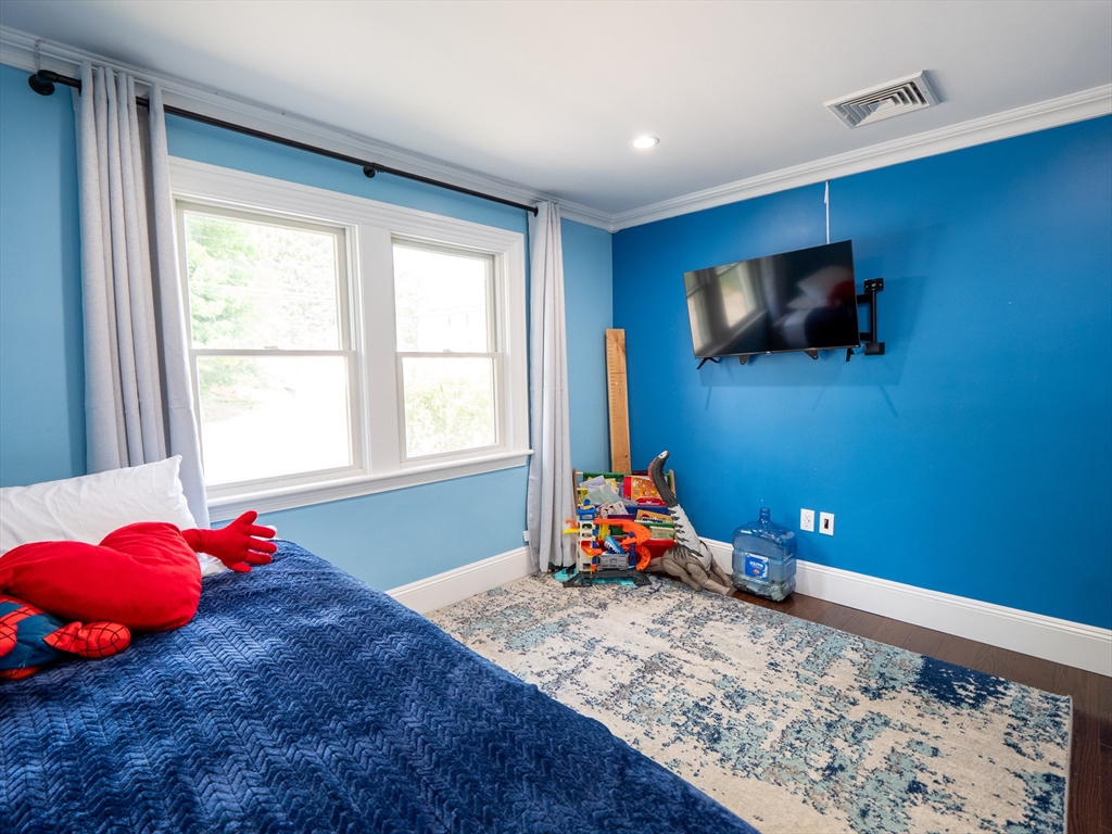 159 Mishawum Road Woburn, MA 01801 - Photo 13 of 41 a room with toys and flat screen tv