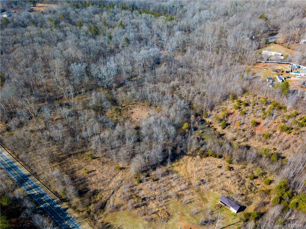 1388 Lawrence Road, Unit 9 Clover, SC 29710 - Photo 1 of 3 a view of a dry yard with trees