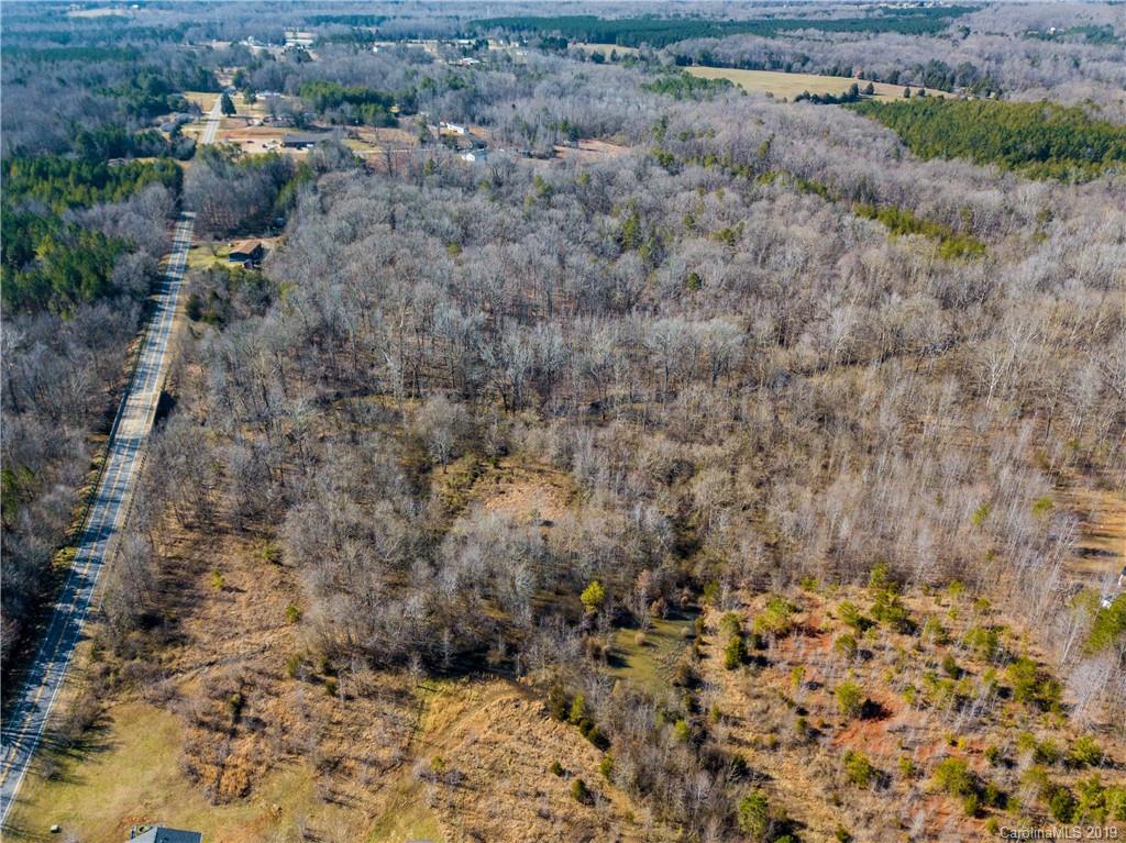 1388 Lawrence Road, Unit 9 Clover, SC 29710 - Photo 3 of 3 a view of a dry yard covered with trees