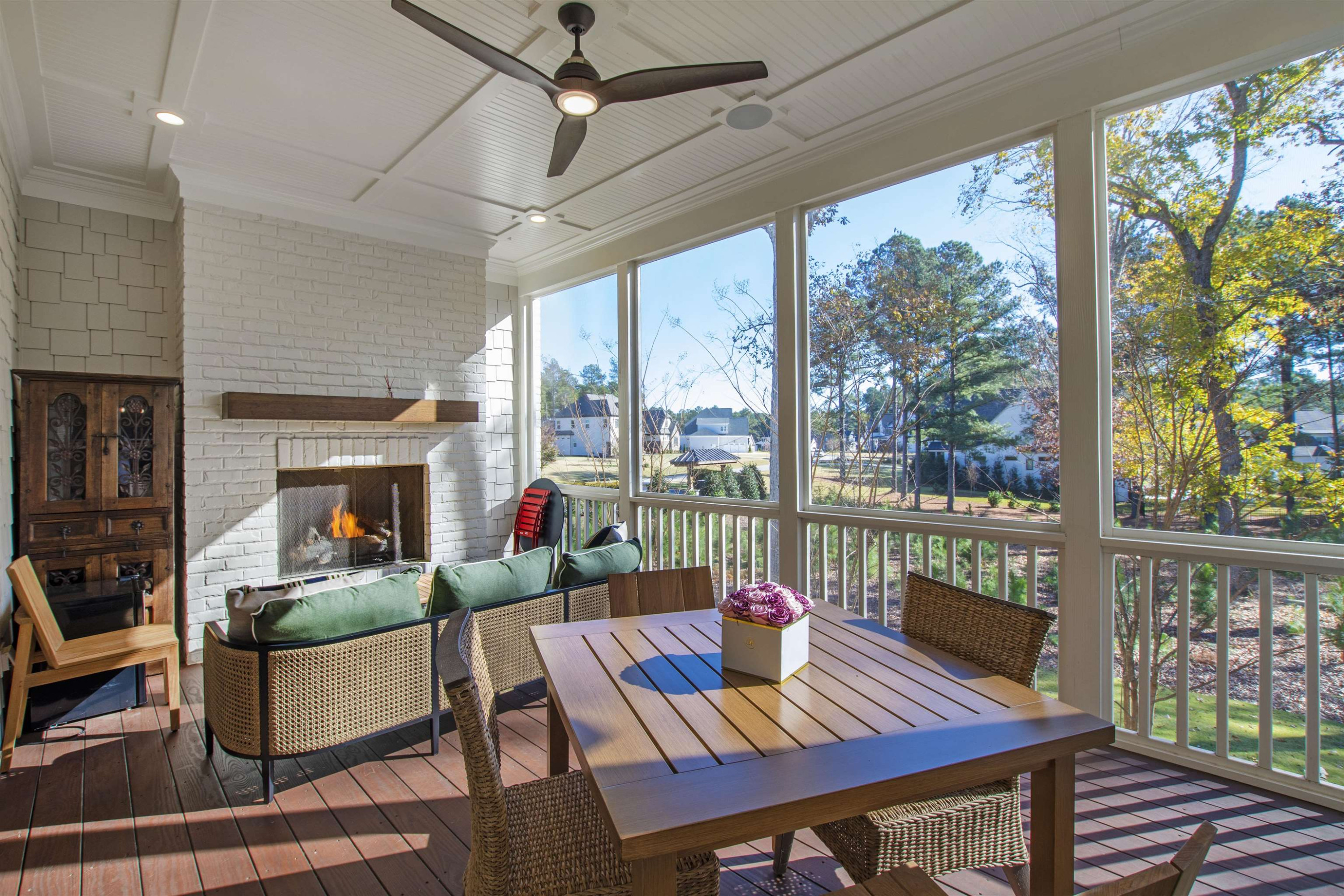 10340 Grafton Road Raleigh, NC 27615 - Photo 20 of 70 a living room with furniture a fireplace and a floor to ceiling window