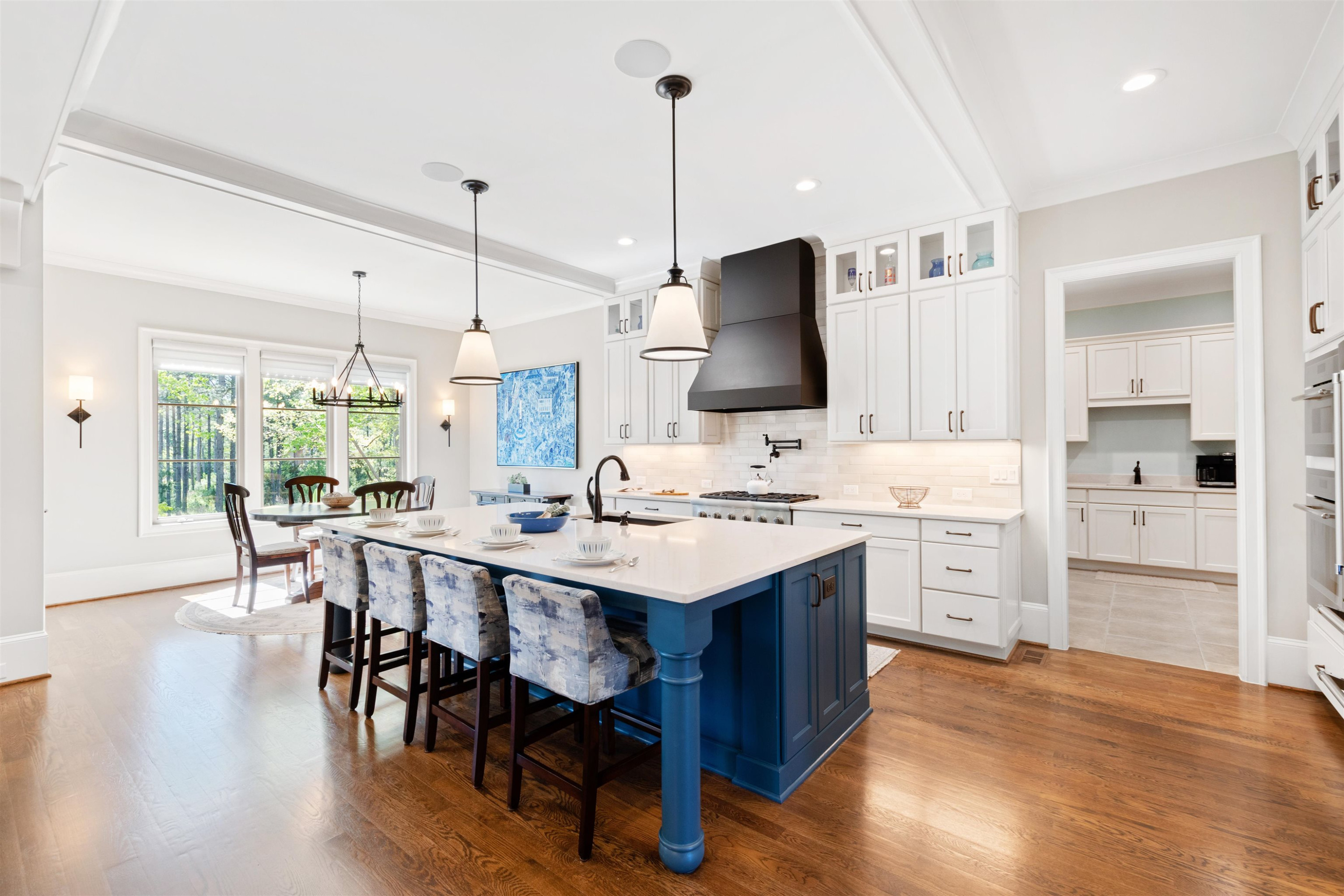 10340 Grafton Road Raleigh, NC 27615 - Photo 23 of 70 a kitchen with a sink stove and white cabinets