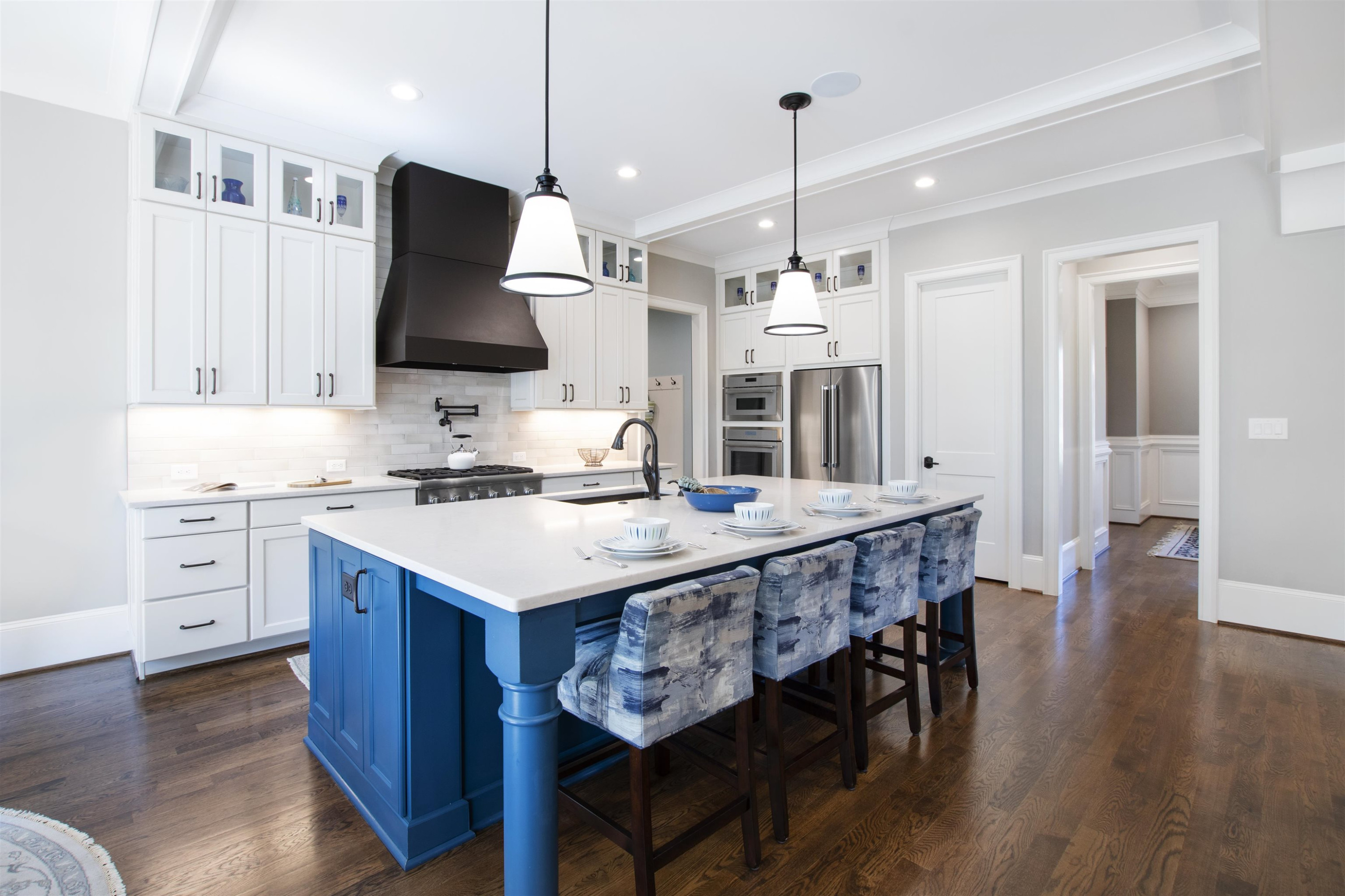 10340 Grafton Road Raleigh, NC 27615 - Photo 26 of 70 a kitchen with granite countertop a stove a sink a dining table and chairs