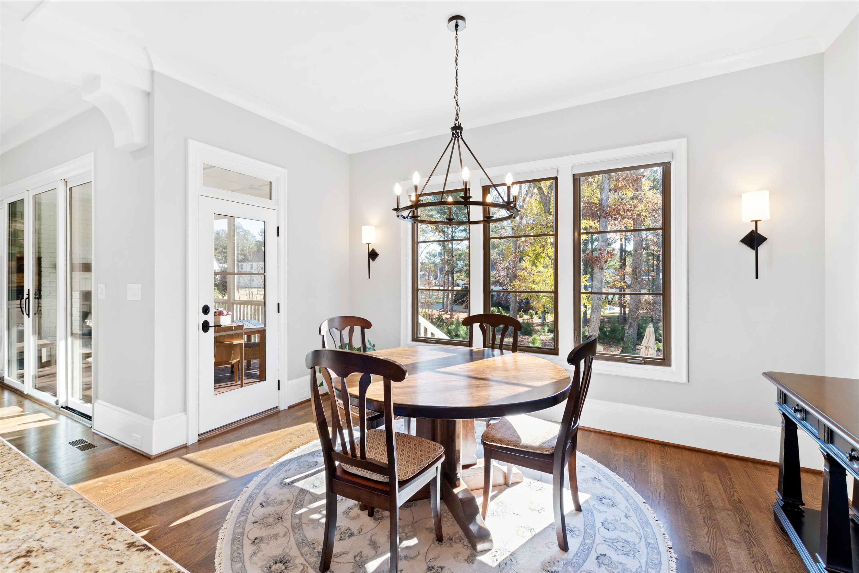 10340 Grafton Road Raleigh, NC 27615 - Photo 29 of 70 a view of a dining room with furniture window and wooden floor