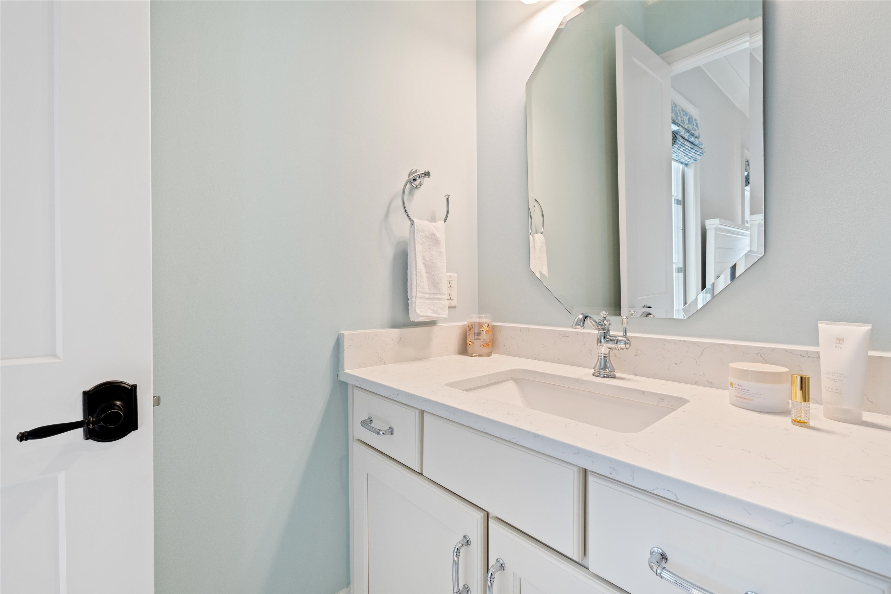 10340 Grafton Road Raleigh, NC 27615 - Photo 41 of 70 a bathroom with a sink and a mirror
