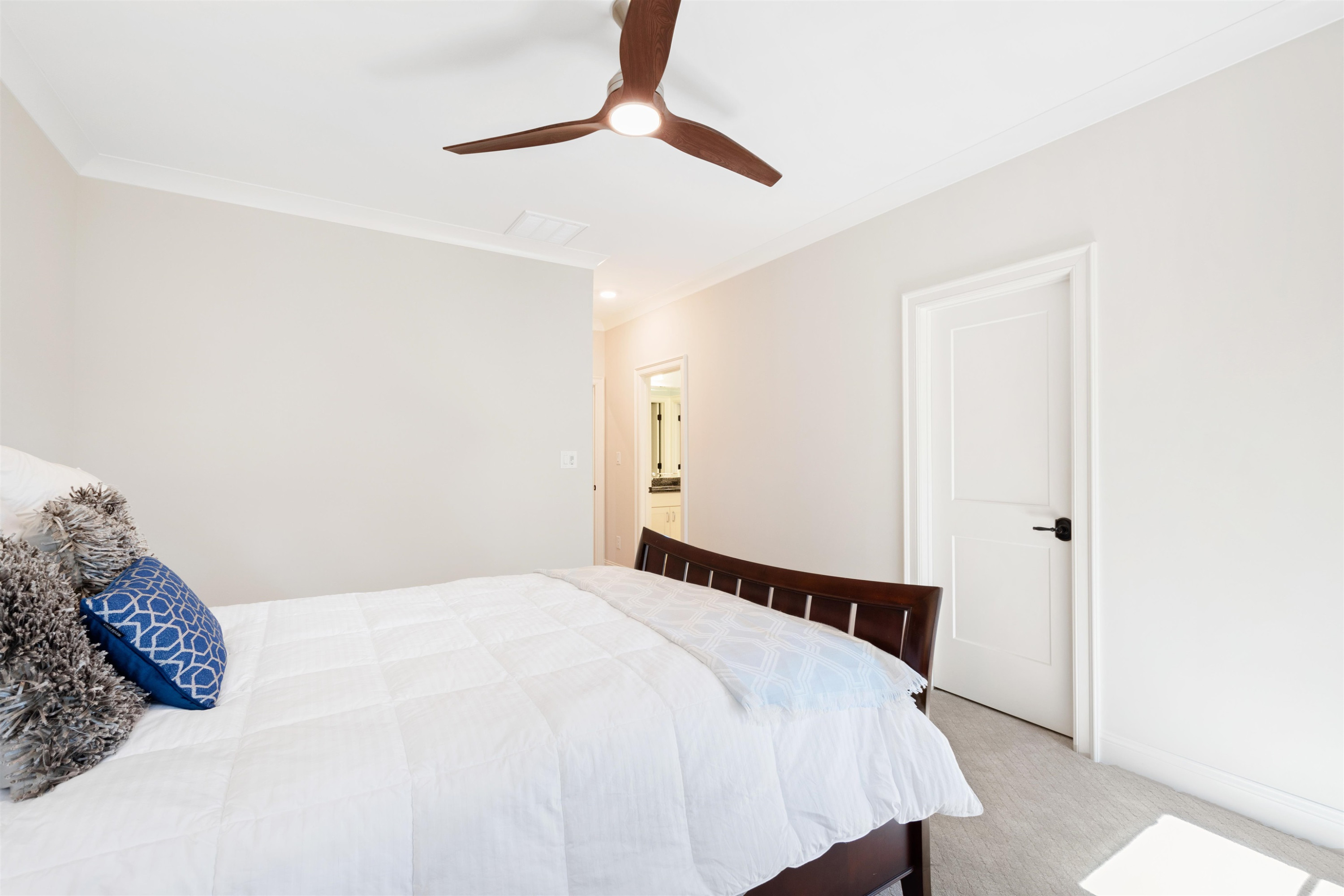 10340 Grafton Road Raleigh, NC 27615 - Photo 49 of 70 a bedroom with a bed and a ceiling fan