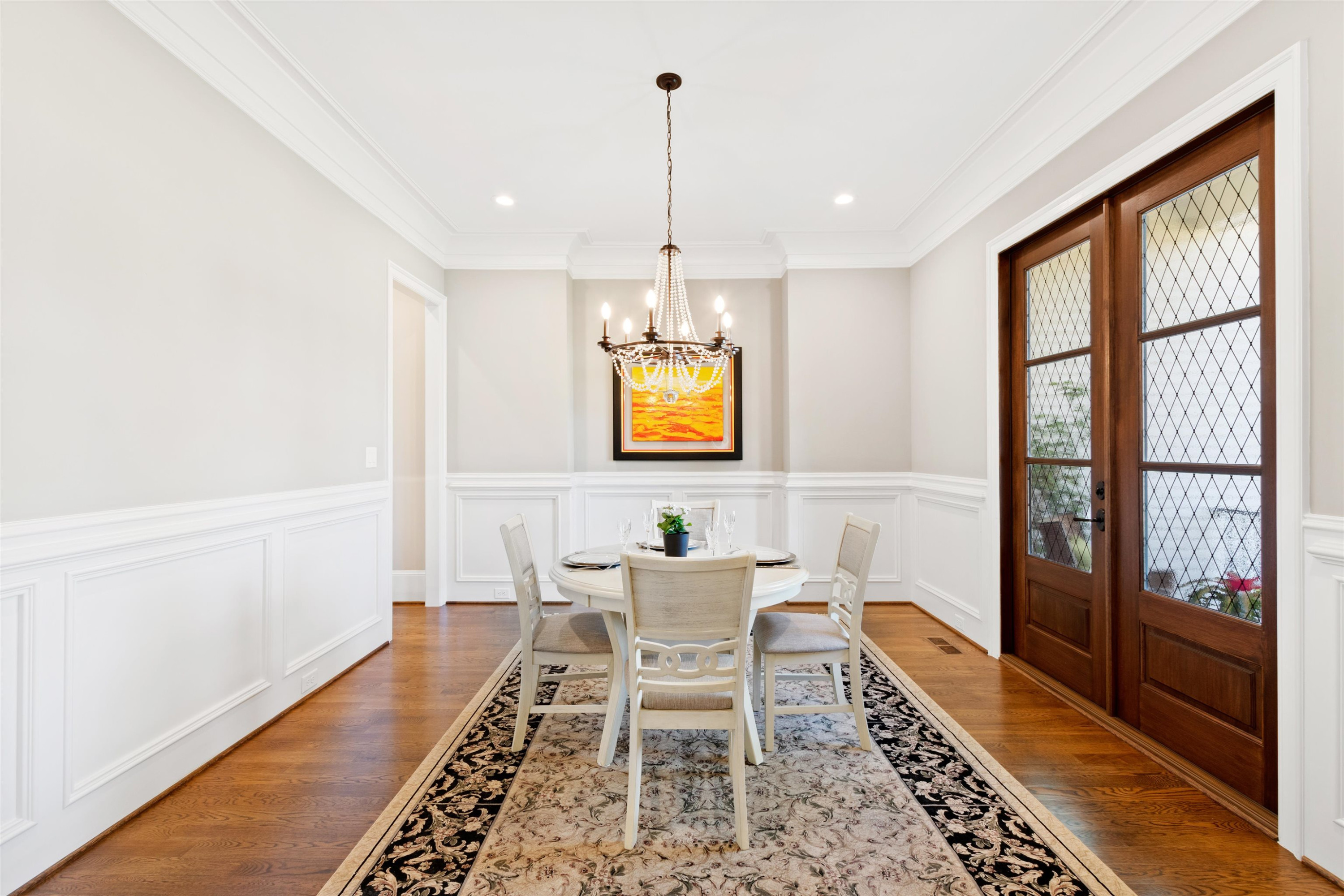 10340 Grafton Road Raleigh, NC 27615 - Photo 9 of 70 a dining room with furniture a rug and wooden floor
