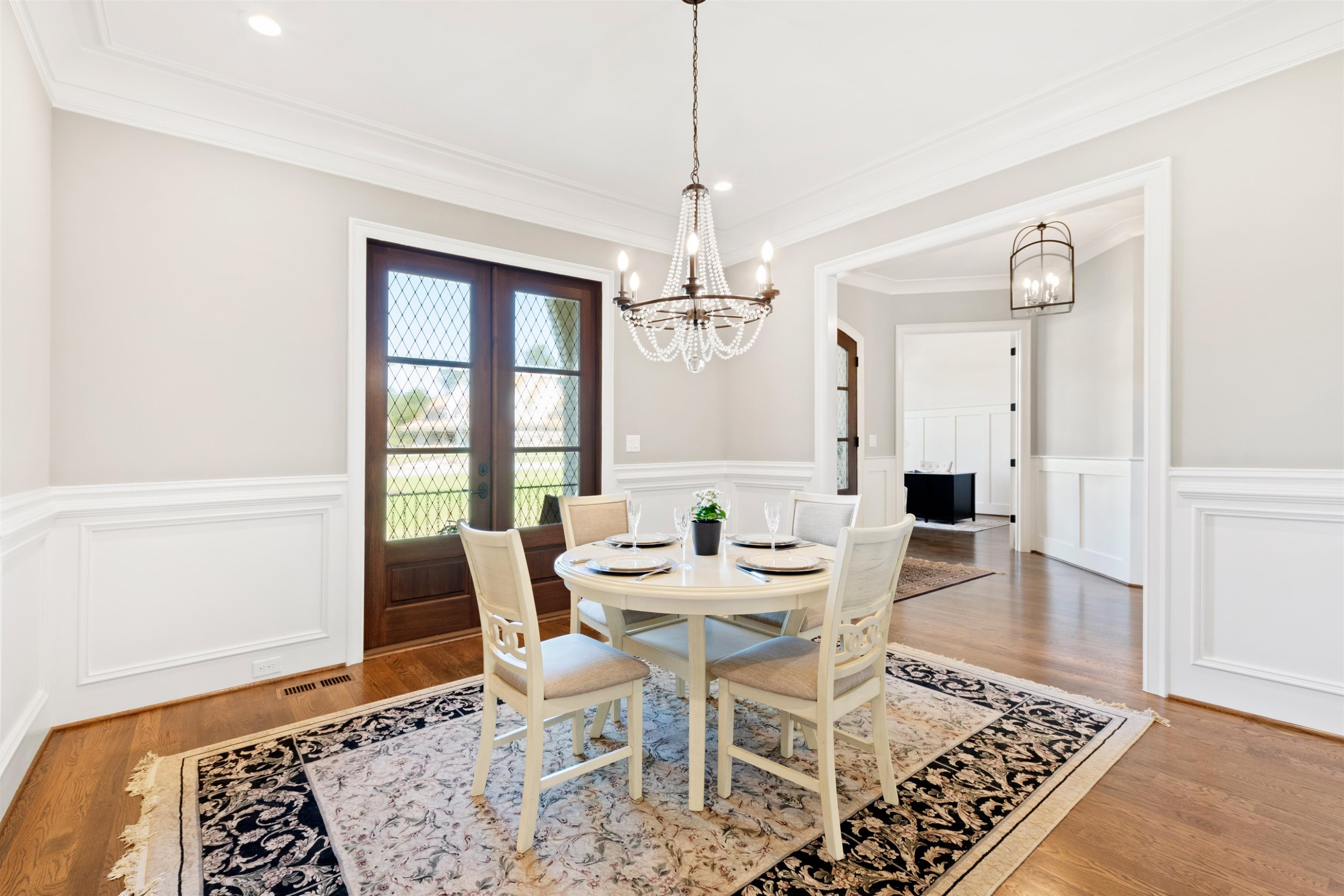 10340 Grafton Road Raleigh, NC 27615 - Photo 10 of 70 a view of a dining room with furniture and wooden floor