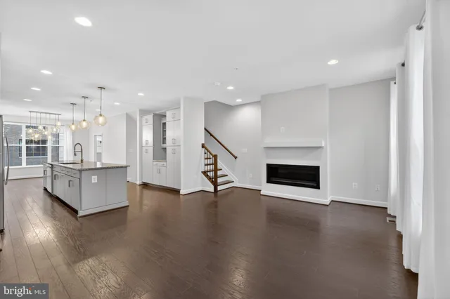 a view of a kitchen with furniture and a flat screen tv