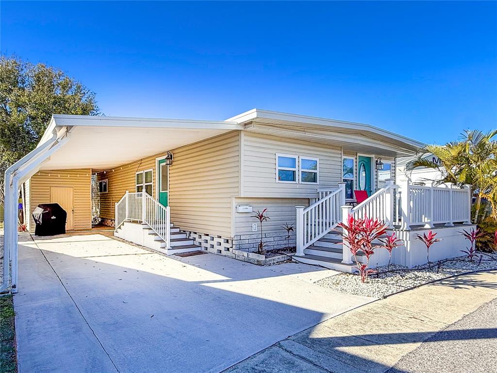 a view of a house with wooden deck