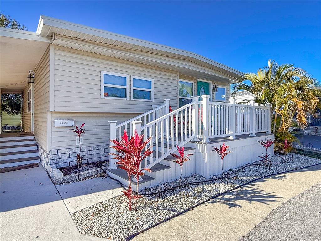 4902 91st Lane North St. Petersburg, FL 33708 - Photo 2 of 41 a view of a pathway with a house in the background