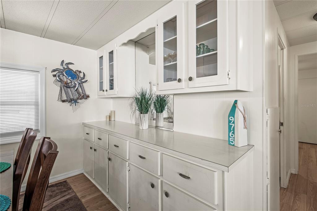 4902 91st Lane North St. Petersburg, FL 33708 - Photo 21 of 41 a view of cabinets a sink and a window