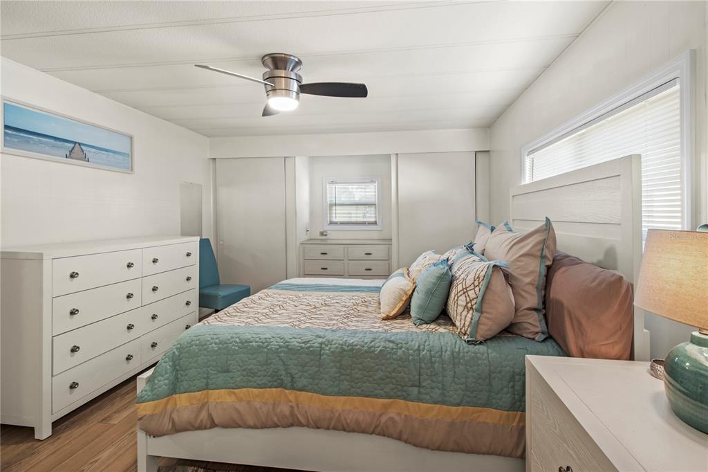 4902 91st Lane North St. Petersburg, FL 33708 - Photo 24 of 41 a bedroom with a bed and with furniture