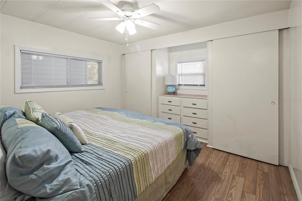 4902 91st Lane North St. Petersburg, FL 33708 - Photo 27 of 41 a bedroom with a bed and a window