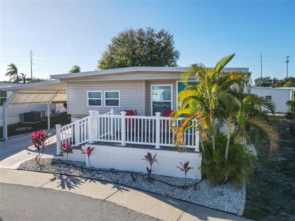 4902 91st Lane North St. Petersburg, FL 33708 - Photo 35 of 41 a view of a chair and table in the patio