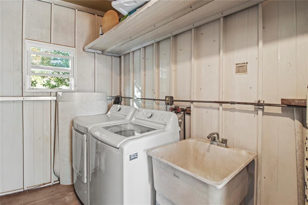 4902 91st Lane North St. Petersburg, FL 33708 - Photo 36 of 41 a bathroom with a sink and a vanity