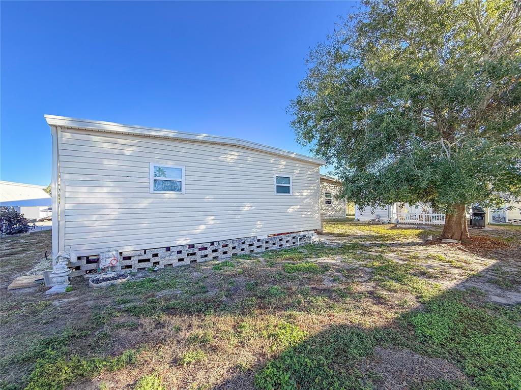 4902 91st Lane North St. Petersburg, FL 33708 - Photo 38 of 41 a view of a house with backyard and sitting area