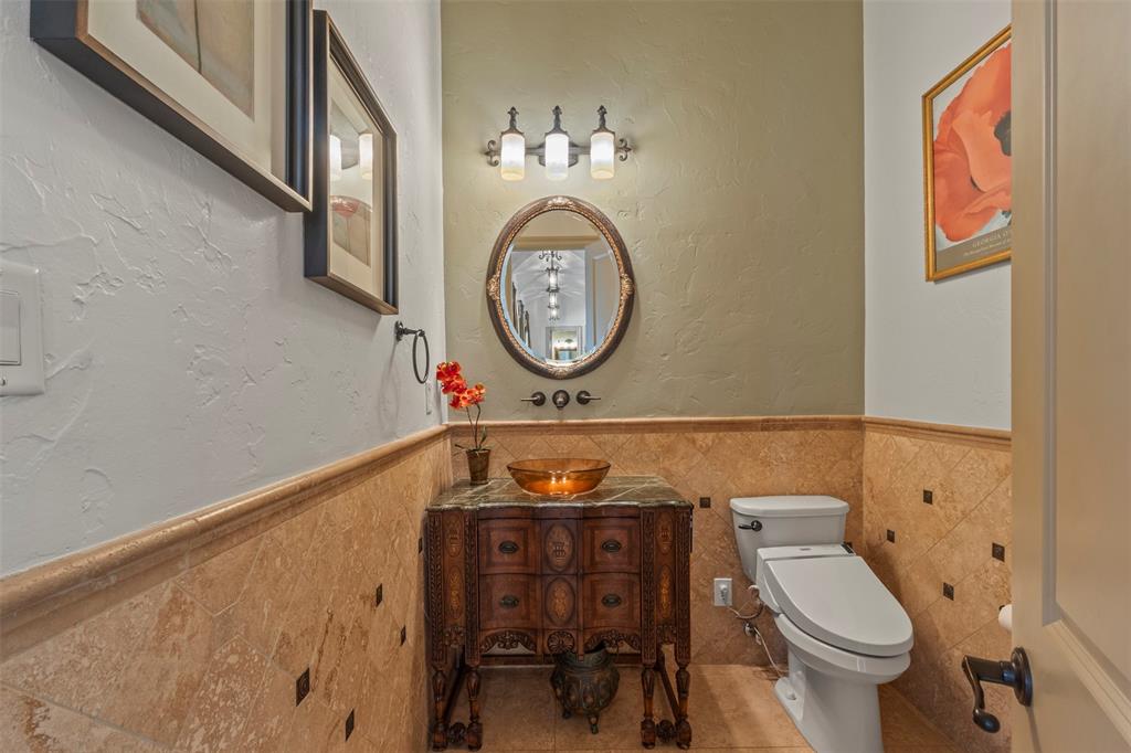 6804 Peter's Path Colleyville, TX 76034 - Photo 27 of 40 Half bath on 1st floor off the living area