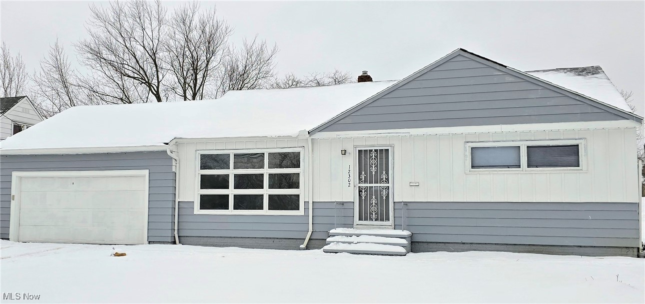 View of front of home featuring a garage