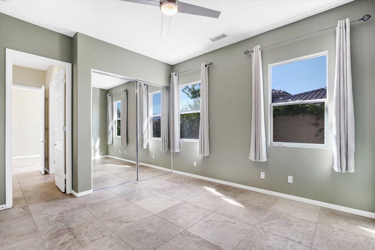3 Trafalgar Rancho Mirage, CA 92270 - Photo 21 of 26 a view of livingroom with hardwood floor and a ceiling fan
