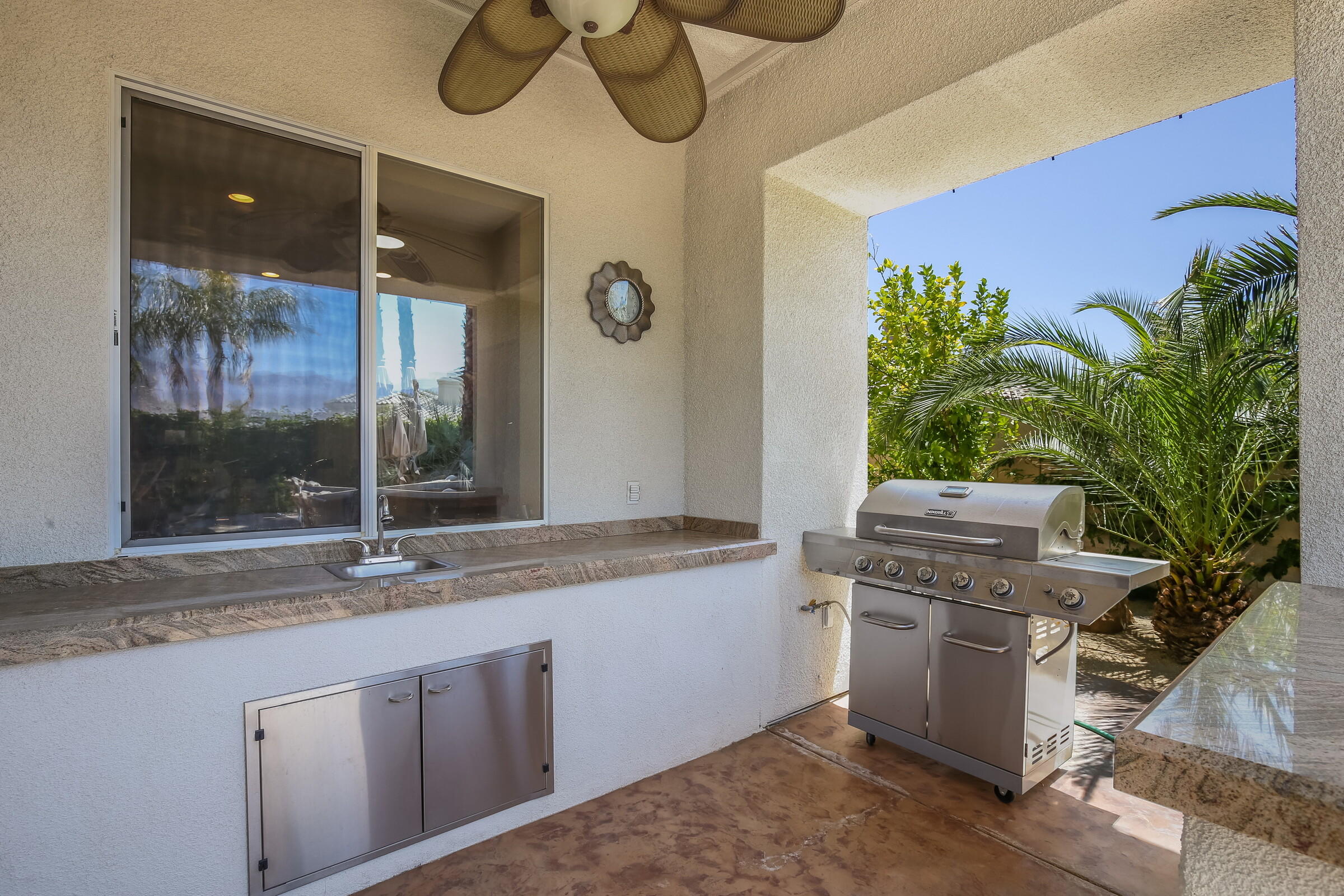 3 Trafalgar Rancho Mirage, CA 92270 - Photo 8 of 26 a kitchen with stainless steel appliances granite countertop a sink a stove and a wooden floors
