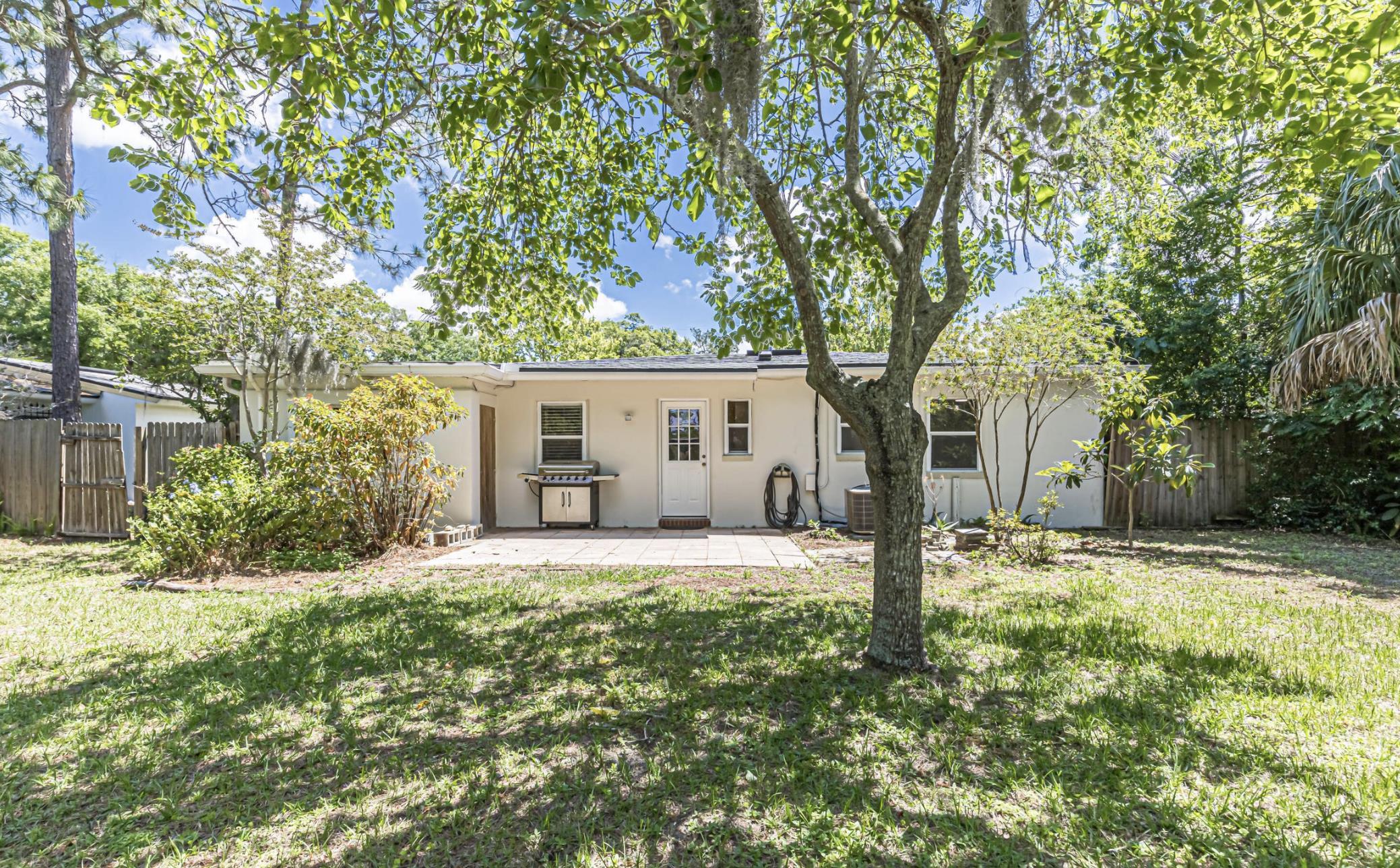 6154 Temple Road Jacksonville, FL 32217 - Photo 23 of 25 a front view of a house with a garden and trees