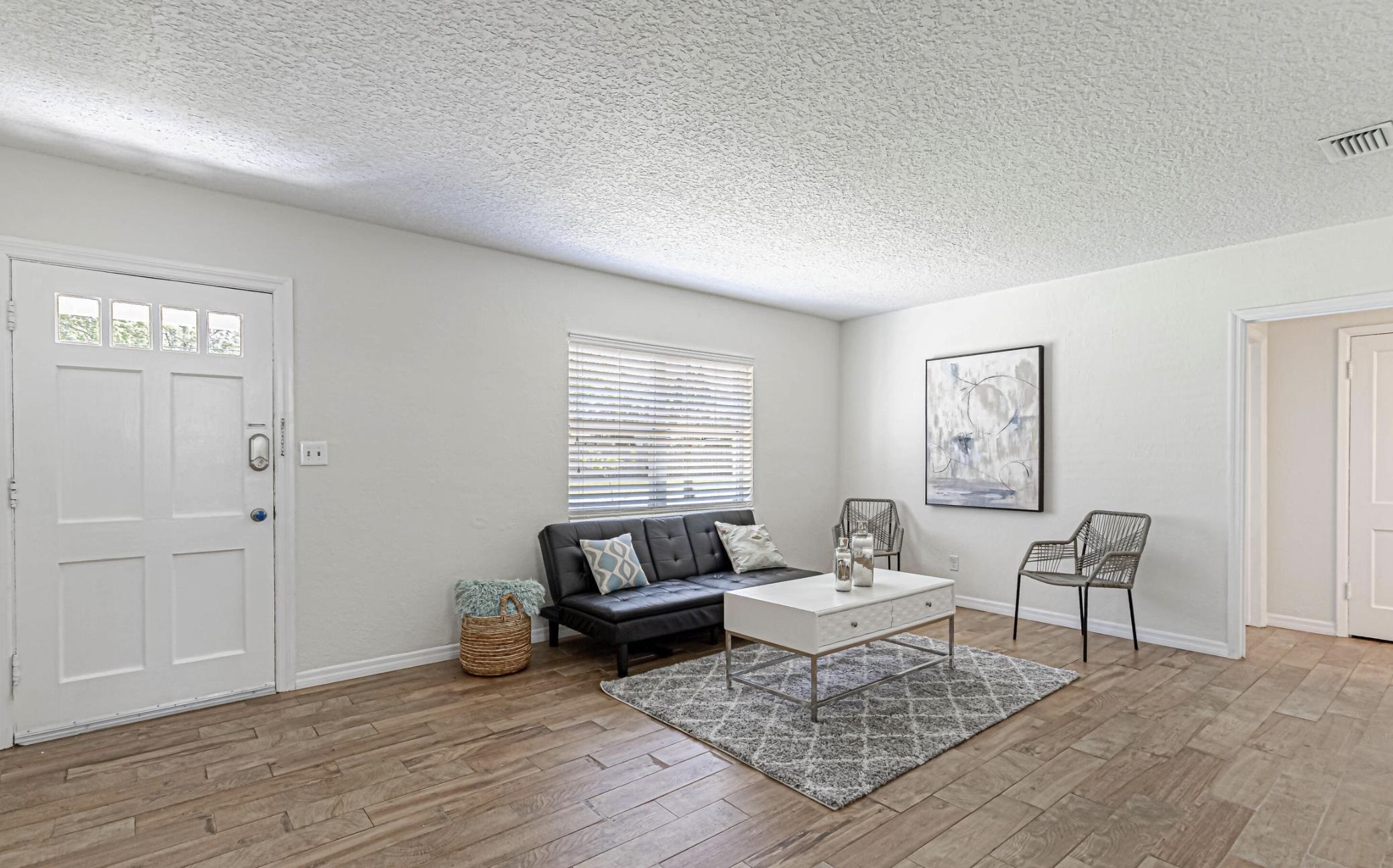 6154 Temple Road Jacksonville, FL 32217 - Photo 6 of 25 a living room with furniture and a wooden floor