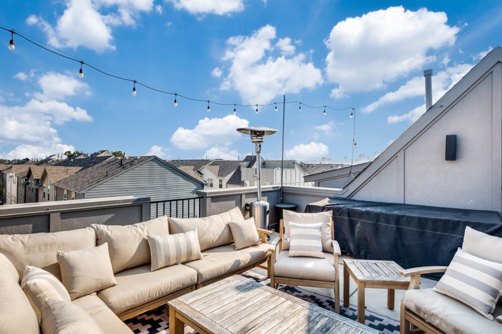 1450 Elevado Drive Dallas, TX 75212 - Photo 1 of 1 a roof deck with couch