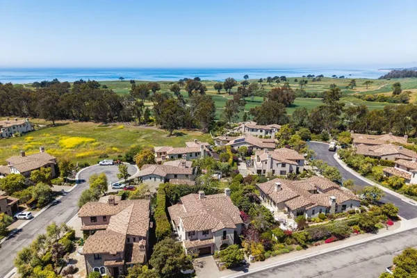 a view of a dining room with furniture wooden floor and a chandelier