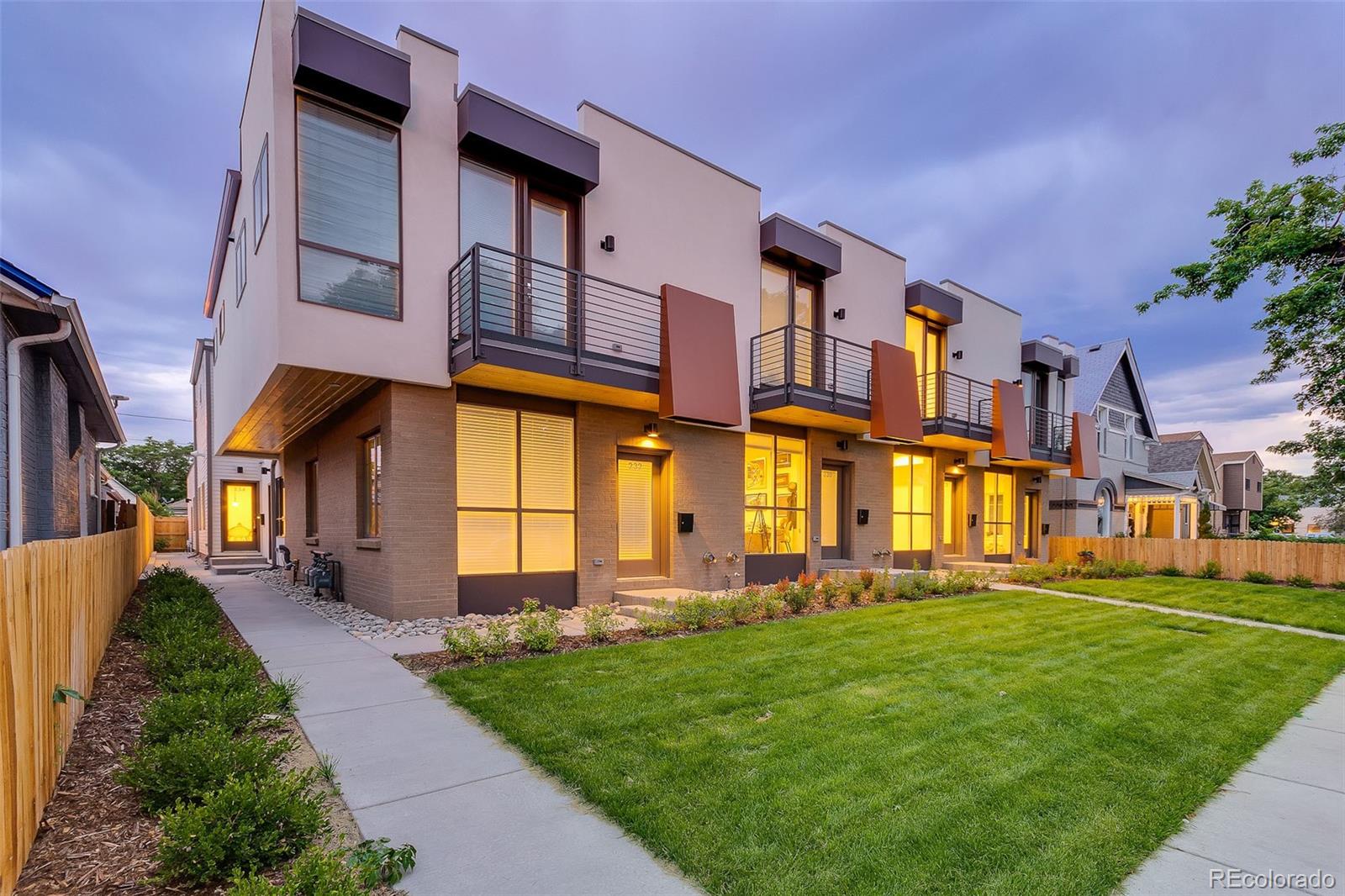 234 Inca Street Denver, CO 80223 - Photo 1 of 27 a front view of a residential apartment building with a yard