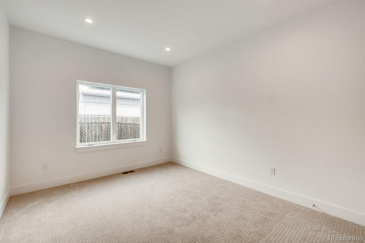 234 Inca Street Denver, CO 80223 - Photo 12 of 27 an empty room with a window